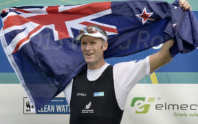 New Zealand's Mahe Drysdale celebrates after he finished second of the men's single sculls on September 6, 2015 in Aiguebelette-Le-Lac, during the world rowing championships. AFP PHOTO / JEFF PACHOUD (Photo by Jeff PACHOUD / AFP)