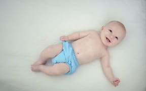 baby in cloth nappy