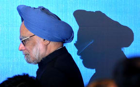 (FILES) India's Prime Minister Manmohan Singh walks on stage for a photo opportunity as part of the 5th East Asia Summit in Hanoi on October 30, 2010. - India's former prime minister Manmohan Singh died December 26, 2024 aged 92 after he was admitted to hospital for an illness, the country's leader Narendra Modi said. (Photo by Christophe ARCHAMBAULT / POOL / AFP)
