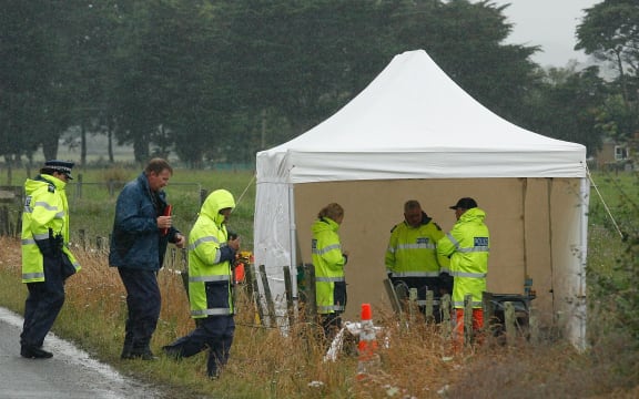 Emergency personnel at the site of the crash in 2012.