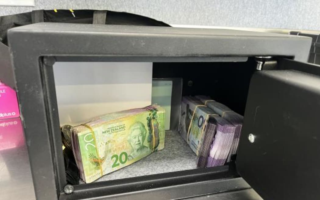 Police in Rotorua seized two firearms, MDMA, and $30,000 cash after carrying out several searches as part of Operation Denim on 11 December, 2023.