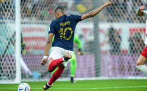 Kylian Mbappe of France trying to score during the FIFA World Cup Qatar 2022 Round of 16 match between France and Poland at Al Thumama Stadium on 4 December 2022 in Doha, Qatar.