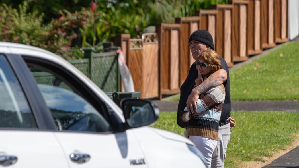 Onlookers at murder scene in Waitaki Street, Henderson, west Auckland