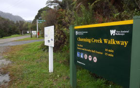 The sign detailing the truncated Charming Creek walkway, at the Ngākawau end.