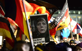 Sympathizers of German right-wing populist movement PEGIDA (Patriotic Europeans Against the Islamisation of the Occident) attend their twelfth march in Dresden.