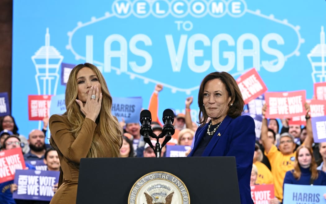 US singer Jennifer Lopez (L) greets US Vice President and Democratic presidential candidate Kamala Harris during a campaign rally at the Craig Ranch Amphitheater in Las Vegas, Nevada, on 31 October, 2024.