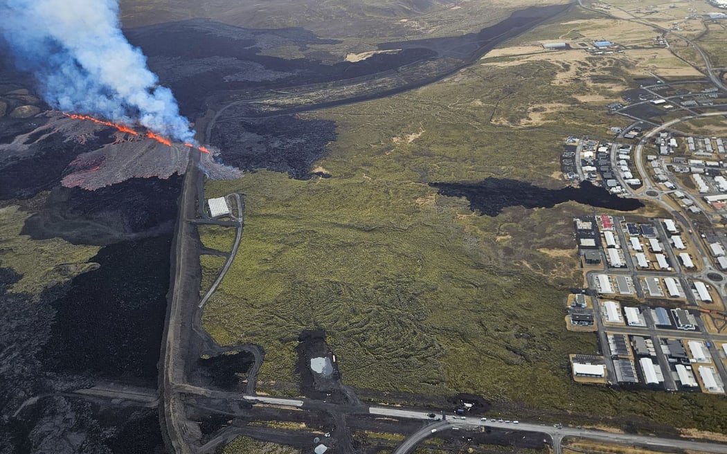 This Icelandic Department of Civil Protection and Emergency Management Hand Out image shows molten lava coming out of a fissure on the outskirts of the fishing village Grindavik in southwest Iceland, on April 1, 2025. The Icelandic Meteorological Office (IMO) said "an eruption has started on the Sundhnuksgigar Crater Row" north of the fishing village Grindavik that was evacuated Tuesday after lava began spewing from a volcanic eruption, the eighth to hit the region since the end of 2023. (Photo by Icelandic Department of Civil Protection and Emergency Management / AFP) / RESTRICTED TO EDITORIAL USE - MANDATORY CREDIT "AFP PHOTO /   " - NO MARKETING NO ADVERTISING CAMPAIGNS - DISTRIBUTED AS A SERVICE TO CLIENTS