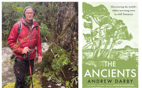 Nature writer Andrew Darby on a hike, standing in front of a big tree. His book cover is beside him.