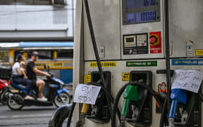 Signs reading 'out of stock' are displayed at a gas station amid rising petrol prices in Manila on March 9, 2026. The price of the main US benchmark for oil surged more than 30 percent on March 9, 2026 over concerns that the Middle East war could create prolonged supply disruptions.