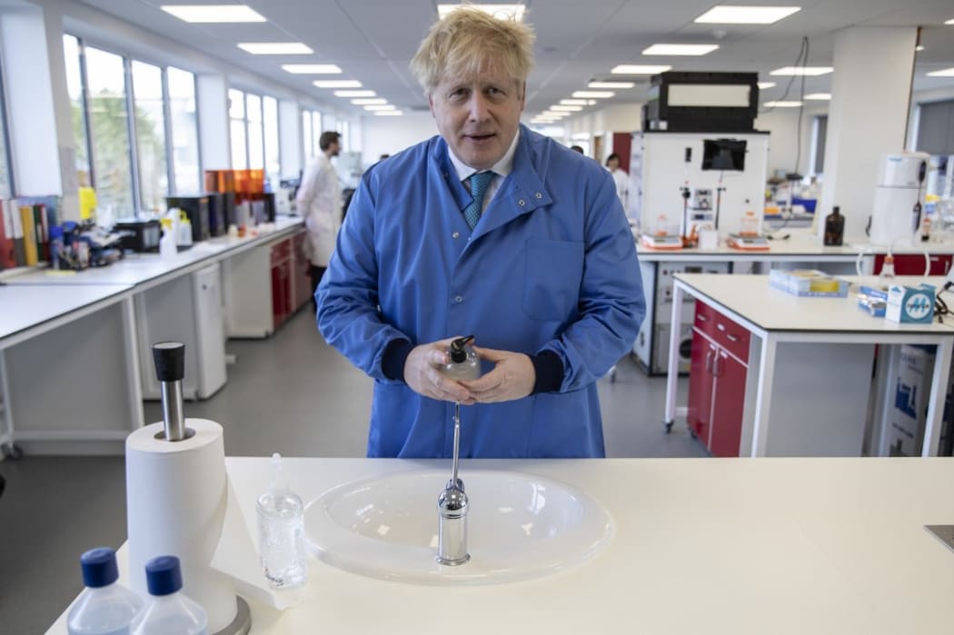 Britain's Prime Minister Boris Johnson gestures during a visit to the Mologic Laboratory in the Bedford technology Park, north of London on March 6, 2020. -