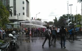 Indonesian police turn water canons on protestors who were mostly university students from Free Papua Organization and the Papua Student Alliance in Jakarta on December 1, 2016.
