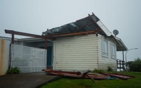 The roof is coming of a house in Newlands, Wellington.