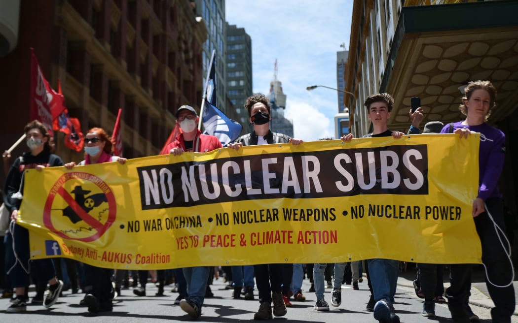 Members of the Sydney Anti-AUKUS Coalition (SAAC) participate in a protest in Sydney, Australia, Saturday, December 11, 2021.