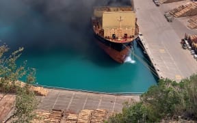 Huge clouds of smoke billow out of a container ship at Napier Port on 18 December, 2020.