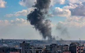 Smoke rises following Israeli bombardment on a position by the border between the Gaza Strip and Egypt in Rafah on February 9, 2024, amid continuing battles between Israel and the Palestinian militant group Hamas. (Photo by SAID KHATIB / AFP)