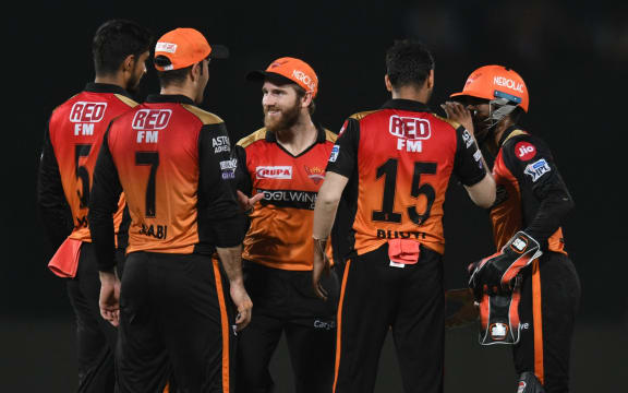 Sunrisers Hyderabad cricket captain Kane Williamson (C) celebrates with teammates during a 2019 Indian Premier League (IPL) Twenty20 match.