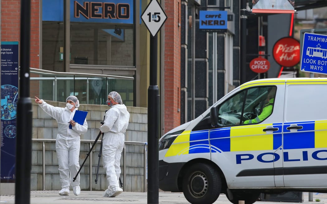 Police forensics officers work outside Arndale Centre shopping complex in Manchester, northwest England on October 11, 2019, following a series of stabbings.