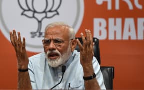 Indian Prime Minister Narendra Modi takes part in a press conference in New Delhi.