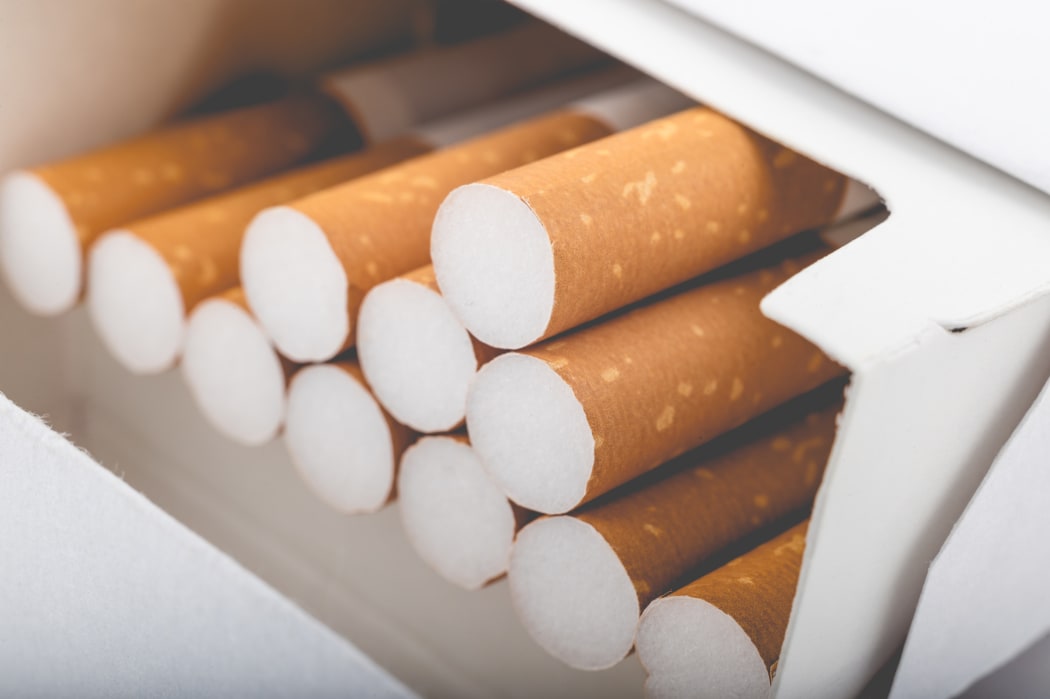 Side view of a pack of cigarettes with faded filter