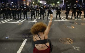Police clash with protestors as residents and activists protest the death of Keith Scott September 21, 2016 in Charlotte, North Carolina.