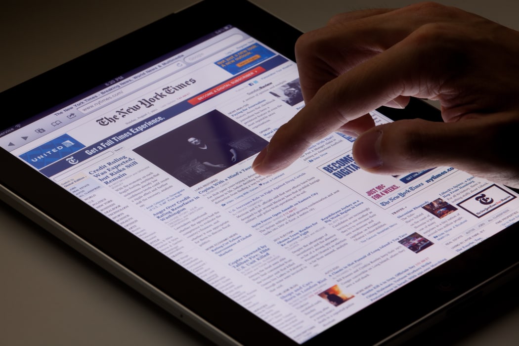 Hong Kong, China - August 7, 2011: Image of browsing the New York Times website using an ipad. The New York Times is a popular American daily newspaper and its website is the most popular American online newspaper website.