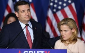 Ted Cruz announces the suspension of his campaign as wife Heidi Cruz looks on.