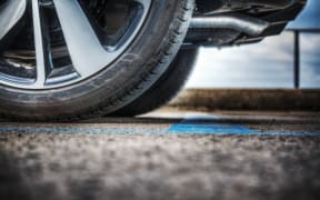 close up of a car wheel on the ground