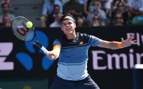 Canada's Milos Raonic plays a forehand return during his men's singles match against Switzerland's Stan Wawrinka on day eight of the 2016 Australian Open, January 25, 2016. AFP PHOTO / WILLIAM WEST