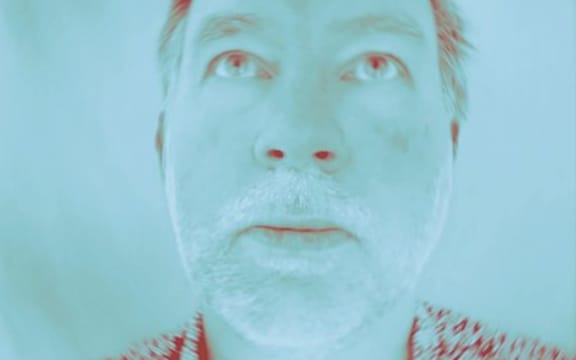 SJD looks above the camera in a saturated image