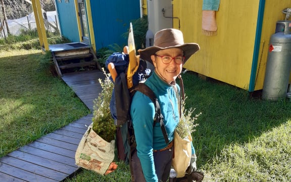 Silvia Pinca carrying some trees