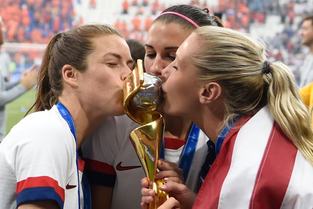 USA's players kiss the trophy after the France 2019 Womens World Cup football final match between USA and the Netherlands.