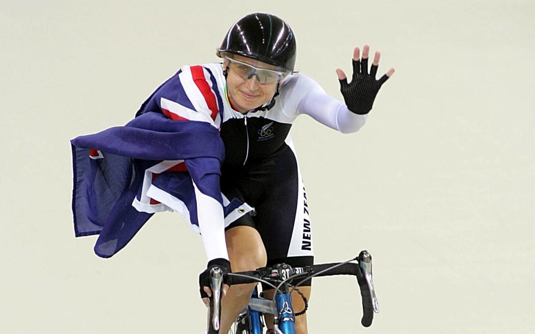 Sarah Ulmer celebrates her gold medal and a world record in the 3000m individual pursuit in Athens.