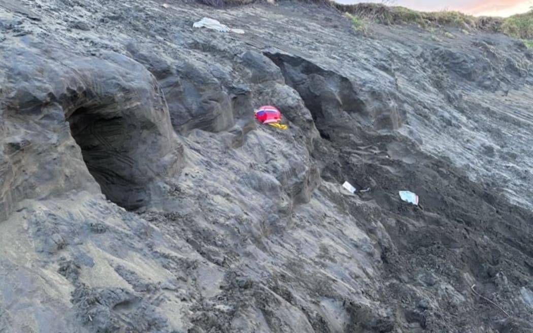 A sand dune collapsed on a man as he was digging into it at Muriwai Beach.