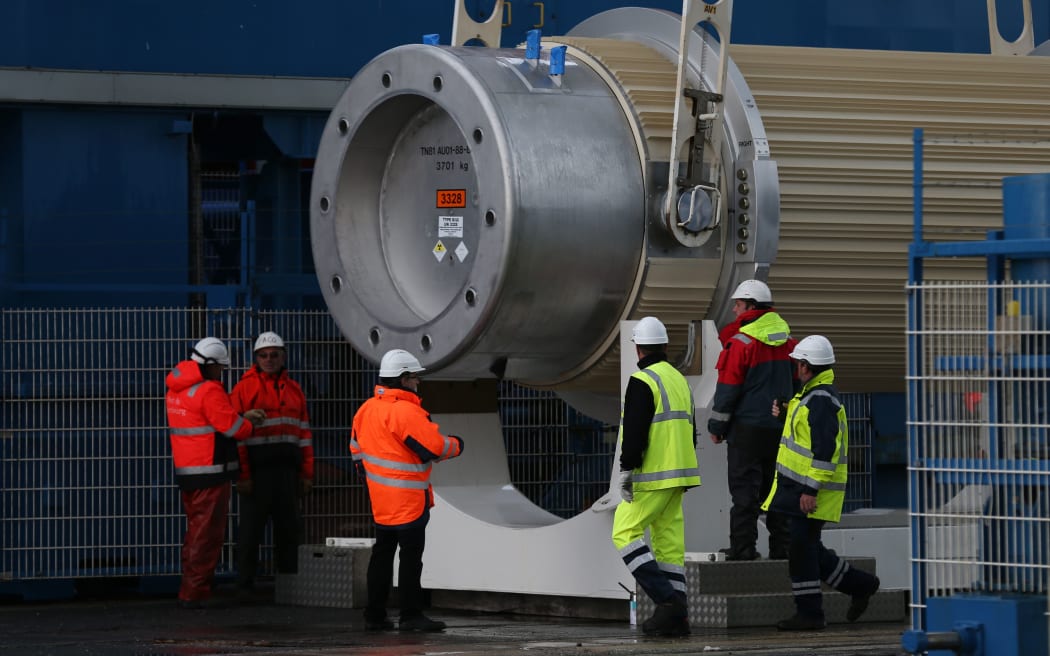Nuclear waste from reprocessing is loaded onto the BBC Shanghai cargo ship on October 15, 2015 in Cherbourg-Octeville, France AFP PHOTO / CHARLY TRIBALLEAU