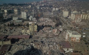 Collapsed buildings during ongoing rescue operations in Kahramanmaras, southeastern Turkey, on February 14, 2023, eight days after a 7.8-magnitude quake struck the country's southeast.