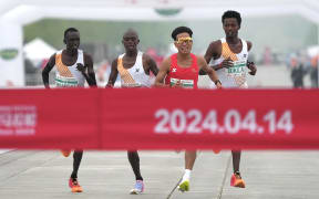 **CHINESE MAINLAND, HONG KONG, MACAU AND TAIWAN OUT** The 2024 Beijing Half Marathon kicks off in Beijing, China, 14 April, 2024. (Photo by Cui Nan / cnsphoto / Imaginechina via AFP)