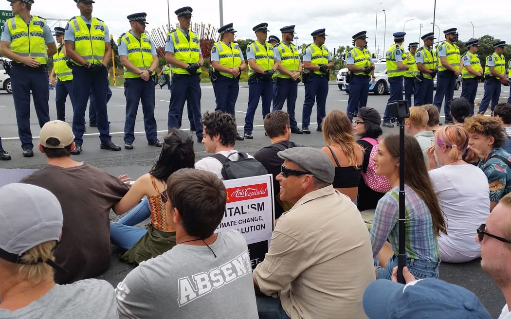 TPP protesters block the entrance to Auckland's motorways at the top of Hobson Street