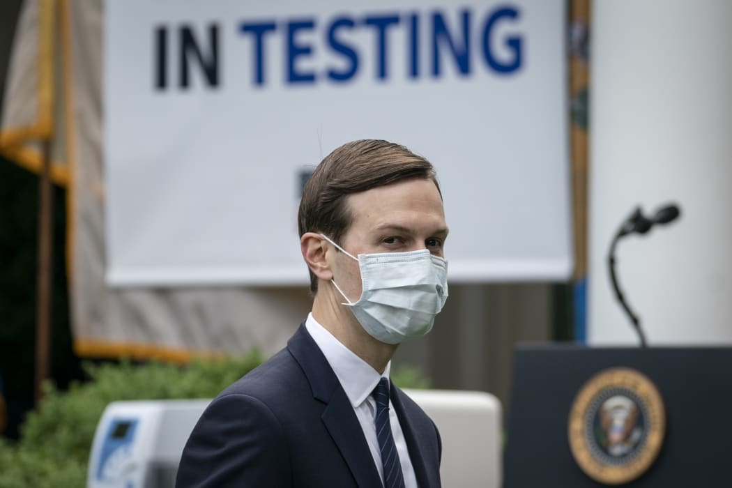 White House adviser Jared Kushner wears a face mask as he departs a press briefing about coronavirus testing in the Rose Garden of the White House.