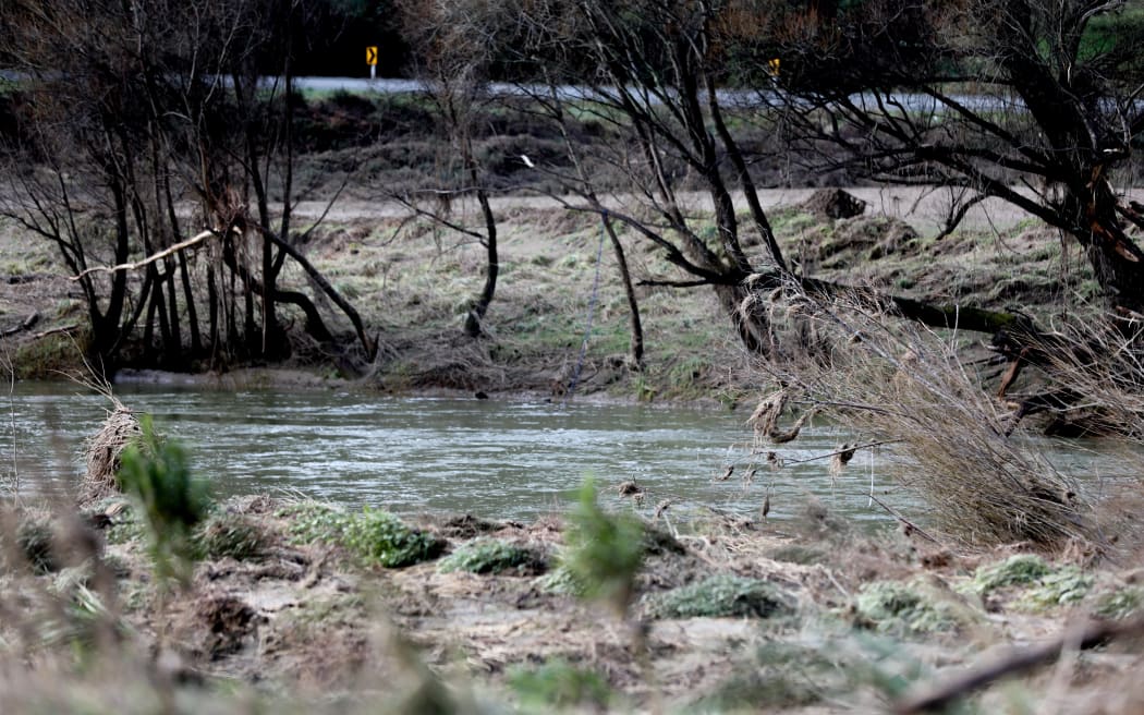 Land near the Motueka River remains laden with silt and debris.
