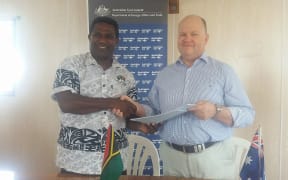 Vanuatu MP Jonny Koanapo and Australian High Commissioner Jeremy Bruer
