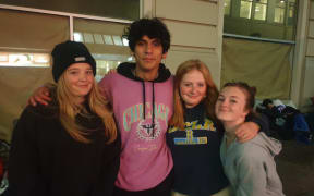 Arian with friends for moral support as he enters his second night in the queue for the latest Nike Air Jordan sneakers.