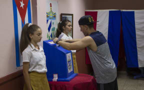 A man casts his vote at a polling station for constitutional referendum in Havana.