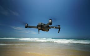 Drone flying over the ocean
