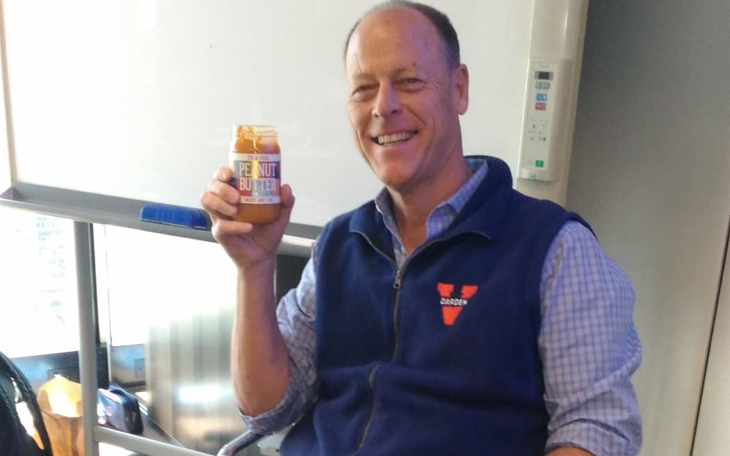 Walter Robb holding peanut butter from Fix and Fog.