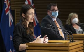 - POOL - Photo by Mark Mitchell.  Prime Minister Jacinda Ardern during the post-Cabinet press conference with Energy Minister Megan Woods and Finance Minister Grant Robertson, Parliament, Wellington. 14 March, 2022.  NZ Herald photograph by Mark Mitchell