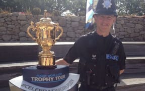 Sergeant Colin Taylor - Scilly Isles police - with the William Webb Ellis Cup