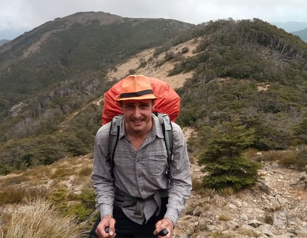 An image of Bruce's hiking buddy Bevan, high on a hill in the Richmond Ranges..