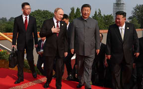 In this pool photograph distributed by the Russian state agency Sputnik, (2nd L-R) Russia's President Vladimir Putin walks with China's President Xi Jinping and North Korea's leader Kim Jong Un before a military parade marking the 80th anniversary of victory over Japan and the end of World War II, in Beijing’s Tiananmen Square on September 3, 2025. (Photo by Alexander KAZAKOV / POOL / AFP)