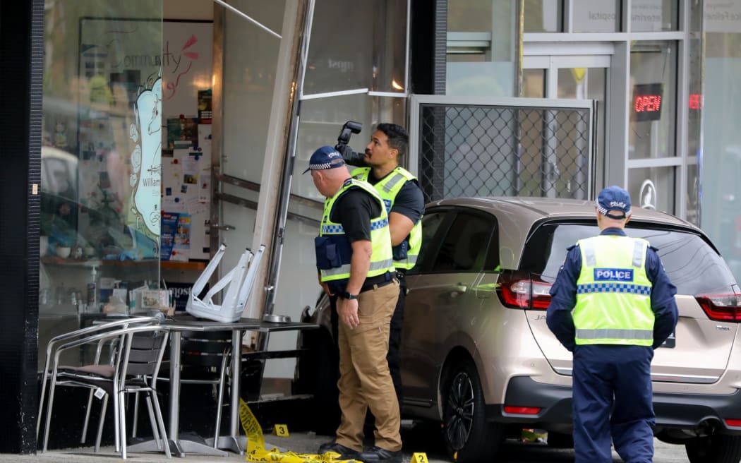 A woman at an Auckland cafe has been left bleeding and with life-threatening injuries after a car crashed into the building in Auckland.