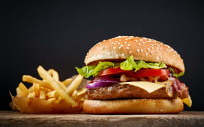Burger with fries.